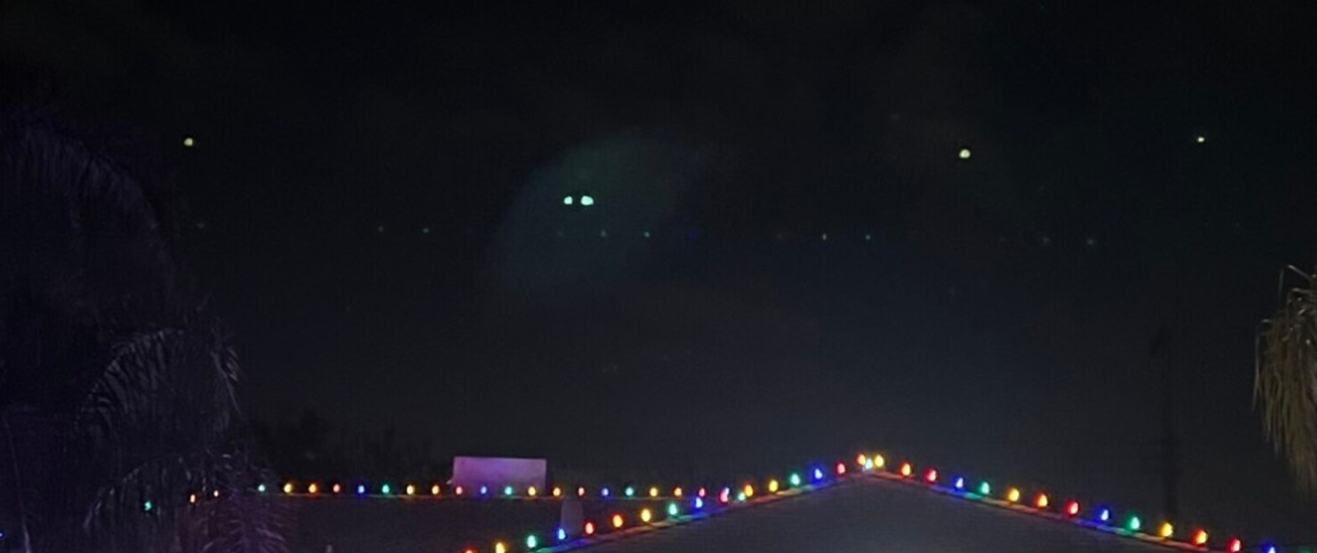 Holiday light installation in El Dorado Hills, CA: multicolor c9 roofline run hip roof